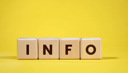 Word info on wooden cubes on a yellow background. Business concept.の写真素材