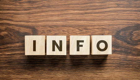 Info word made with wooden blocks on the wooden background.の写真素材