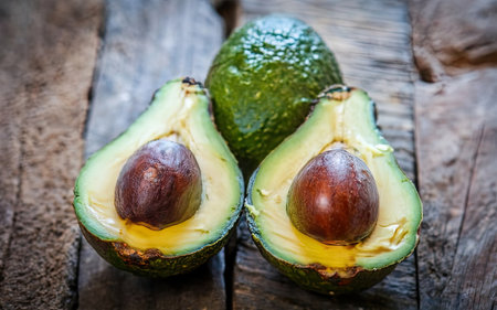 Avocado on a wooden background. The concept of healthy eating.の素材