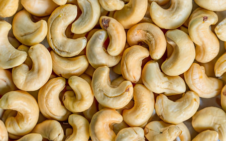 Roasted cashew nuts background. Healthy food. Top view.の素材