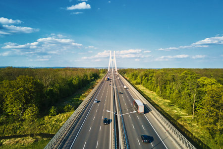 Large modern bridge over river in europe city with car traffic, aerial view. Redzinski bridge over...