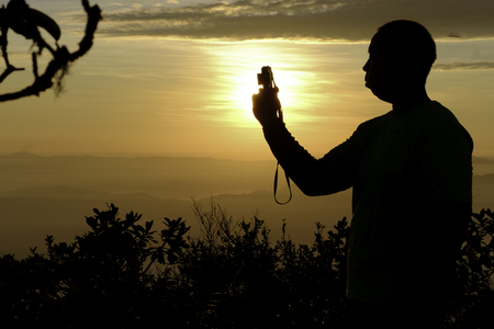 Silhouette people take photo actionの写真素材