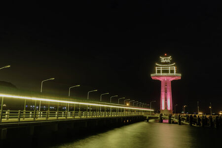 evening time view of lighthouse in the sea at Si Chang island, Thailandの写真素材