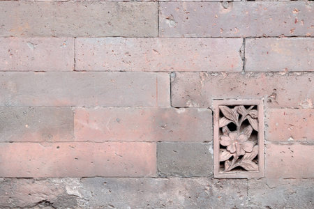 Stone wall with stone flower