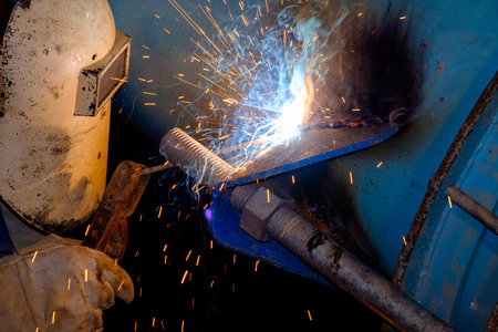 electric welding on steel water pipeの写真素材