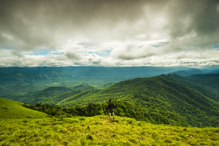 a man stand up and looking forward at Doi Lung Tak, 1175 msl, Tak province Thailandの写真素材
