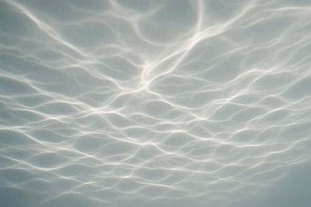 Underwater view of the sea water surface with ripples and sunlightの素材