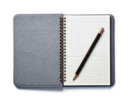 Notebook and pencil isolated on white background, clipping path included.の素材