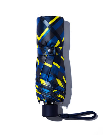 Modern umbrella isolated on a white background. Clipping path included.の素材