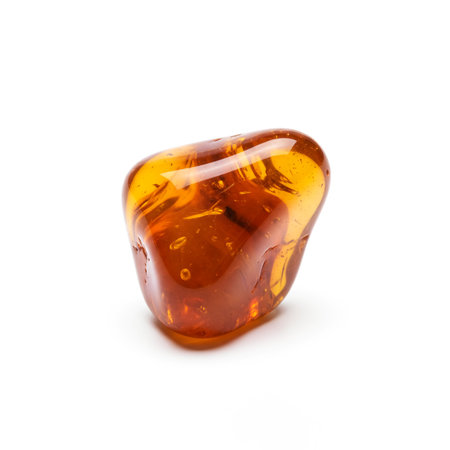 Amber gemstone isolated on white background.の素材