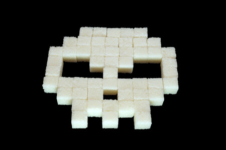 Skull from white sugar cubes. Diabetes.の写真素材