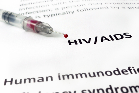 Paper with Hiv aids and syringe  with bloodの写真素材