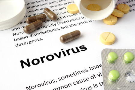 Paper with norovirus and pills.の写真素材