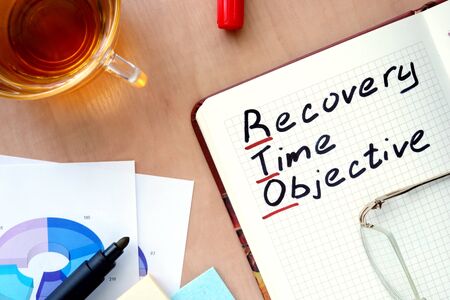 Notepad with word RTO recovery time objective concept and marker.の写真素材