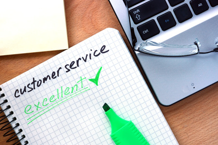 Notepad with words customer service.の写真素材