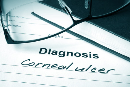 Diagnosis list with Corneal ulcer and glasses.の写真素材