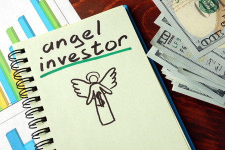 Notebook with angel investors  sign.  Business concept.の写真素材