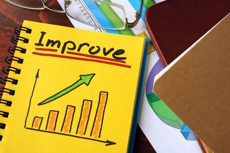 Notebook with improve  sign.  Business concept.の写真素材