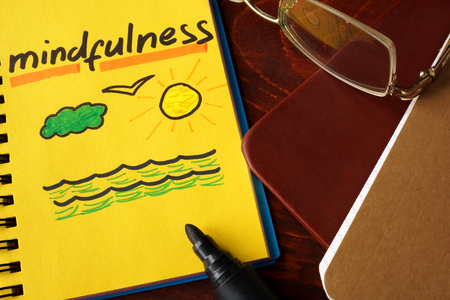 Notebook with  mindfulness sign.の写真素材