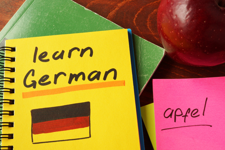 Notebook with learn German  sign. Education concept.の写真素材