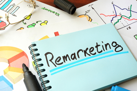 Remarketing written on a notepad sheet. Marketing concept.の写真素材