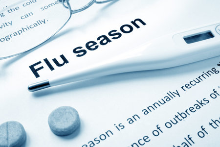 Flu season sign on a paper and glasses.