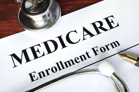 Medicare enrollment form written on a paper.  Medical concept.の写真素材