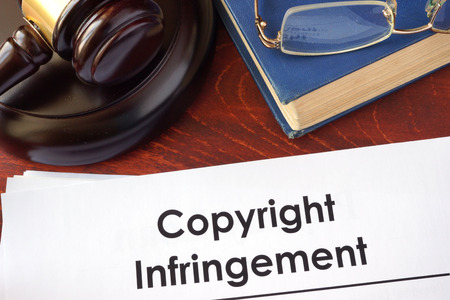 Copyright infringement form on an office table.の写真素材