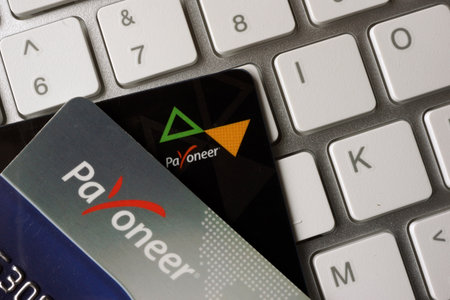 KYIV, UKRAINE - February 04, 2017: Payoneer debt card on a keyboardのeditorial素材