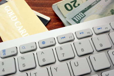 Keyboard, credit card and cash.