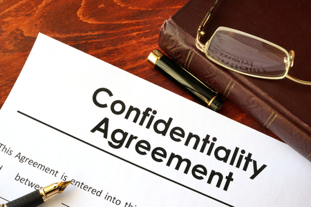 Confidentiality Agreement form on a table. Non-disclosure contract.の写真素材