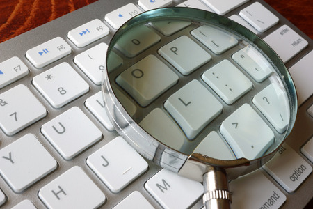 Magnifier and keyboard. Concept of search and audit.の写真素材