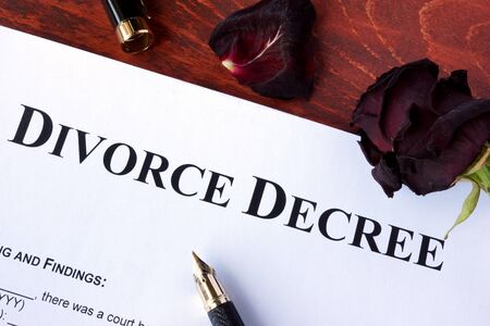 Divorce decree form and faded rose. Separation concept.の写真素材