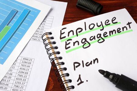 Employee engagement written in a notebook and marker.の写真素材