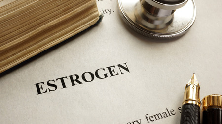 Page with title estrogen and book. Human hormones.の写真素材