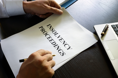 Document with title insolvency proceedings on a desk.の写真素材