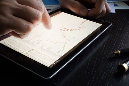 Stock trading data on a tablet screen.の写真素材