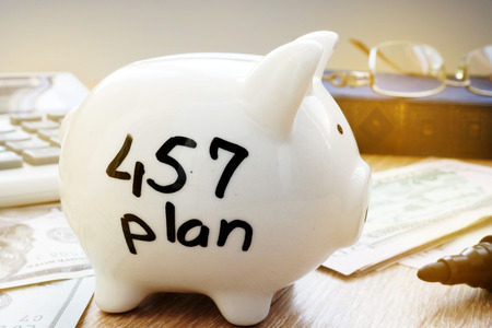 Retirement plan. 457 plan written on a side of piggy bank.の写真素材