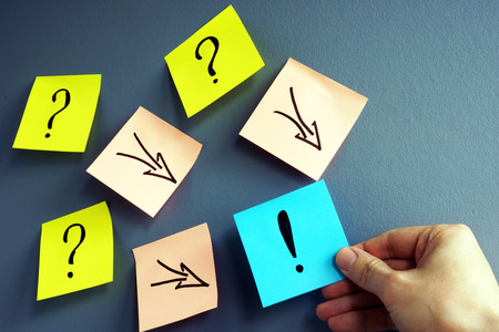 Solving of problem. Answer concept. Question marks and arrows to exclamation mark.の写真素材