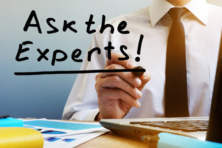 Ask the experts. Man sitting at the table.の写真素材
