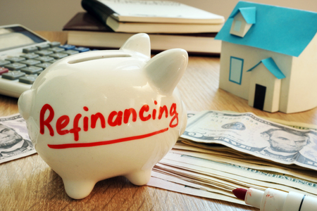 Refinancing written on a piggy bank.の写真素材