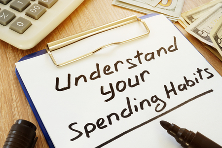 Understand your spending habits written on a clipboard.の写真素材