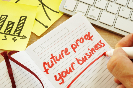 Hand is writing future proof your business.の写真素材