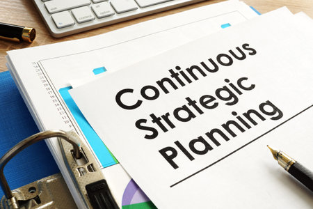 Continuous Strategic Planning on an office table.