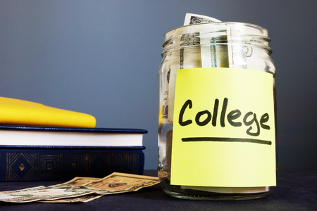 College fund written on a jar and money.の写真素材