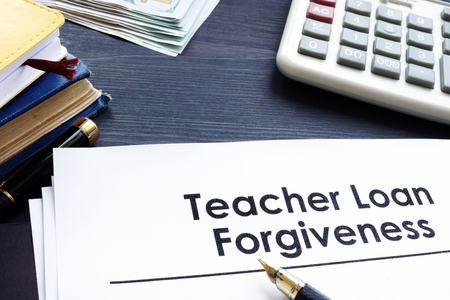 Teacher Loan Forgiveness documents on a table.の写真素材