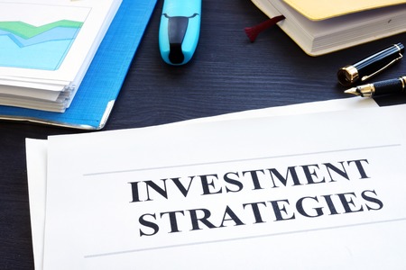 Investment strategies and folder with business documents.の写真素材