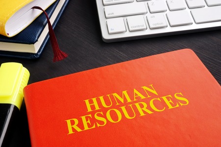 Book about human resources HR on the desk.の写真素材