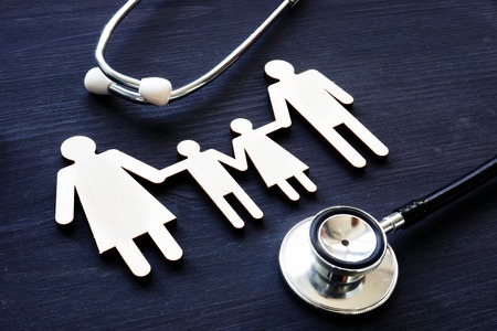 Family medicine. Figures of family and stethoscope.の写真素材