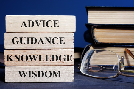 Wooden blocks with words Advice Guidance Wisdom Knowledge.の写真素材